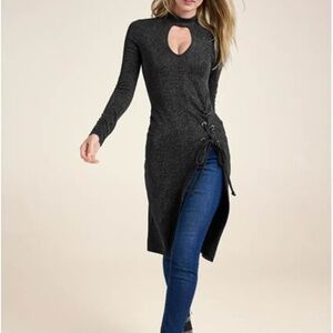 Long length, long sleeve top. With lace up detail at hip. Small cutout at neck.